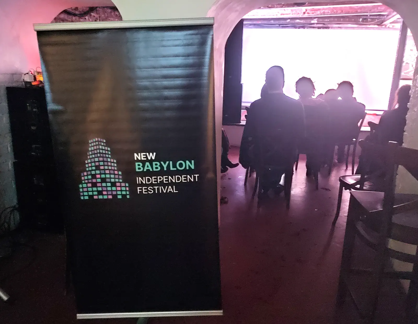 Festival banner beside the audience during the 2025 event.